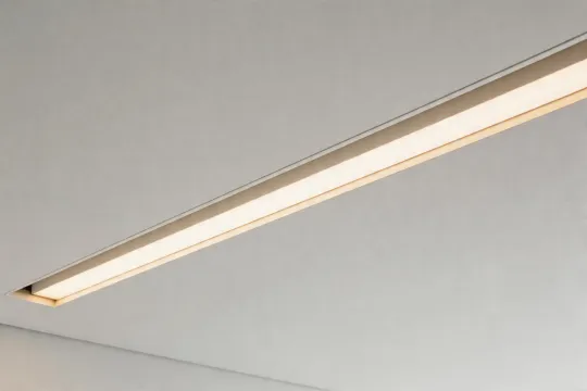Recessed linear luminaire in office ceiling